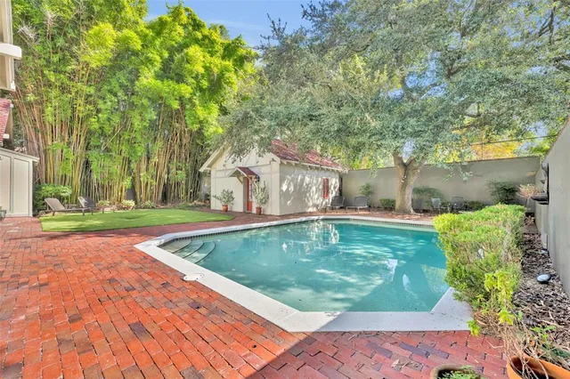a view of a swimming pool with a patio