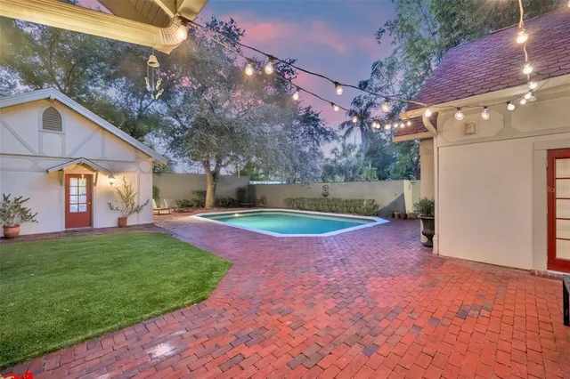 a view of a backyard with large trees