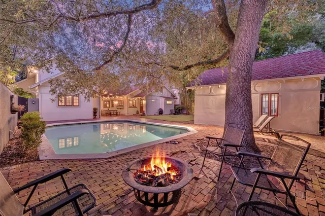 a view of a backyard with sitting area and furniture