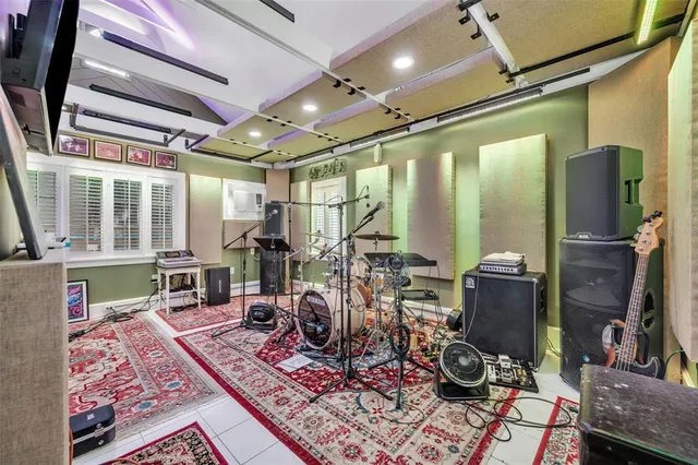 a room with lots of furniture and windows