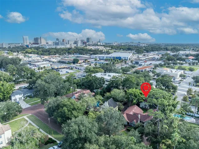 an aerial view of a house with lots of trees