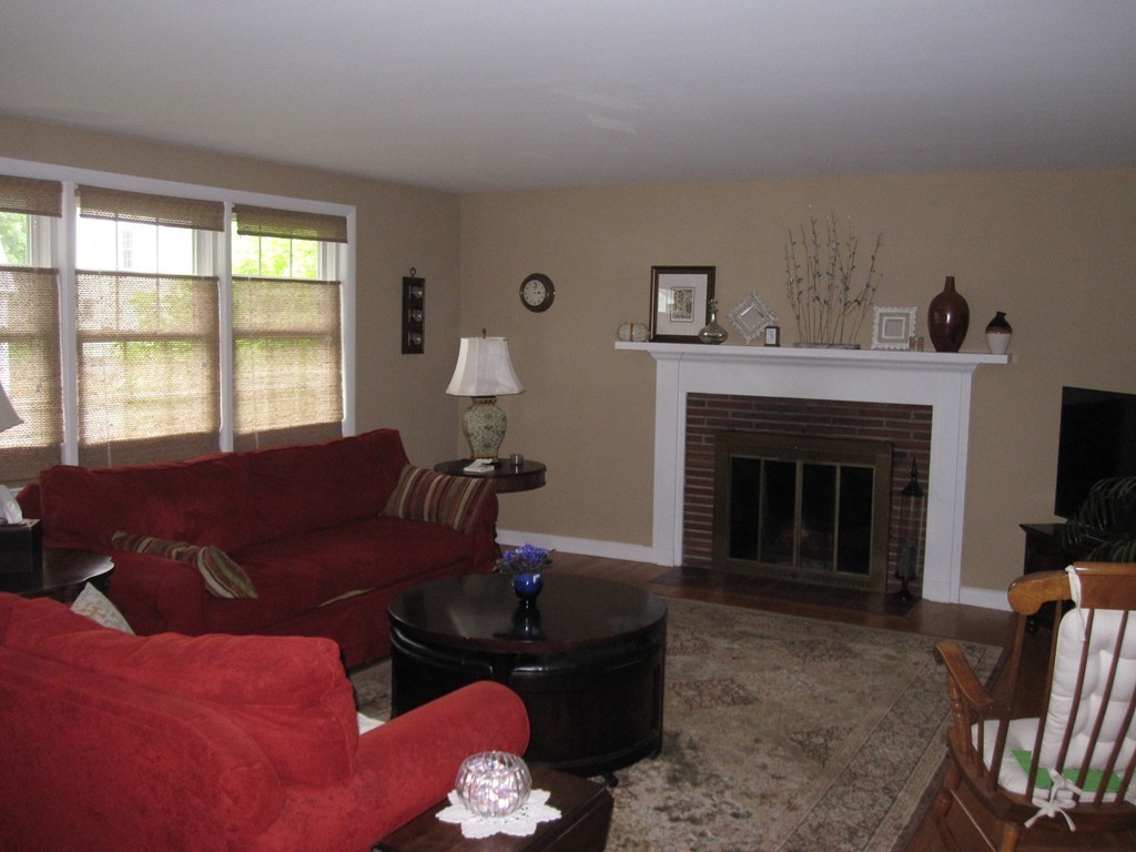 84 Bayview Road Marblehead, MA 01945 - Photo 6 of 9 a living room with furniture and a fireplace