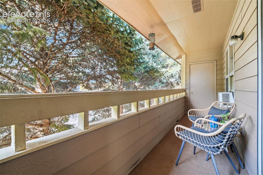 4357 Hunting Meadows Circle Colorado Springs, CO 80916 - Photo 15 of 20 a view of a chair and table in the balcony