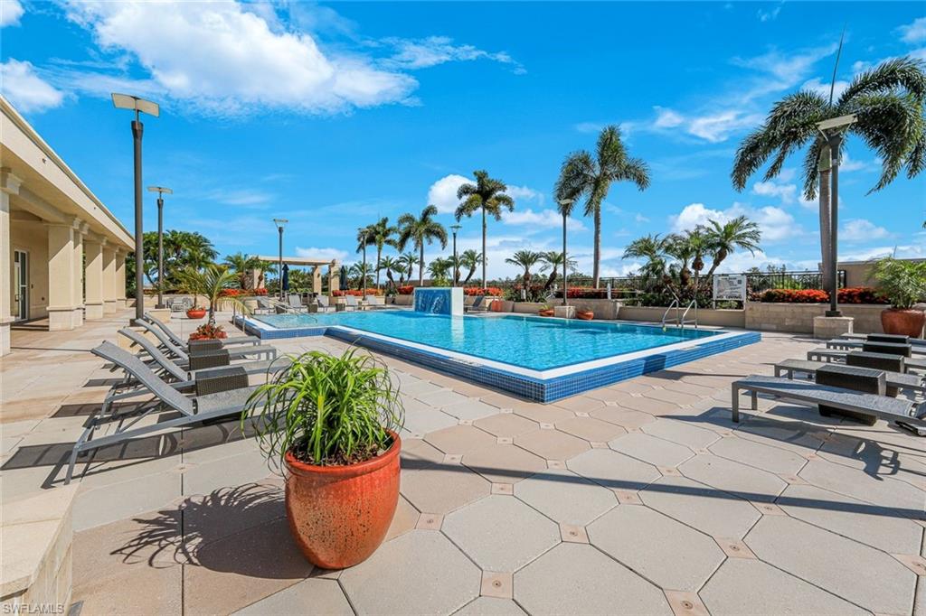 9123 Strada Place, Unit 7201 Naples, FL 34108 - Photo 36 of 50 a view of a backyard with plants and palm tree