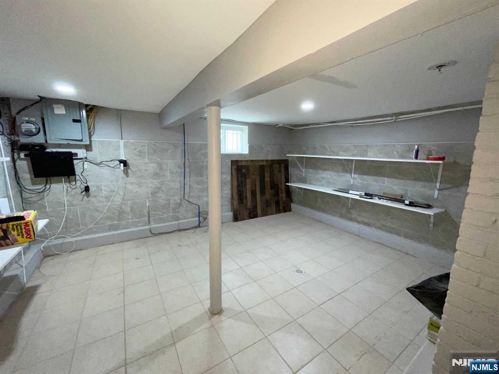 25 Kipp Street Newark, NJ 07108 - Photo 15 of 19 a bathroom with a sink and a shower