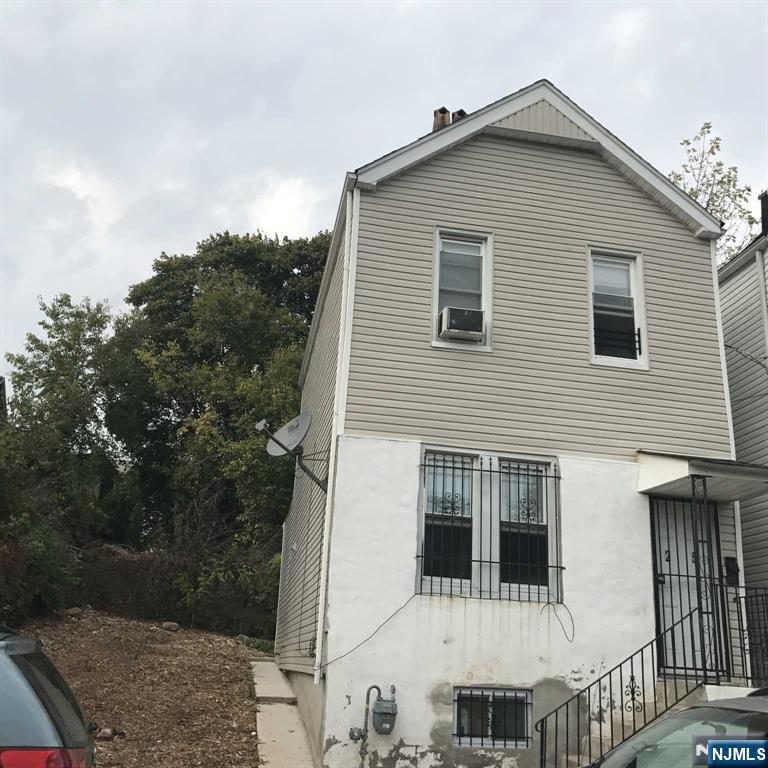 25 Kipp Street Newark, NJ 07108 - Photo 16 of 19 a view of a house with a yard
