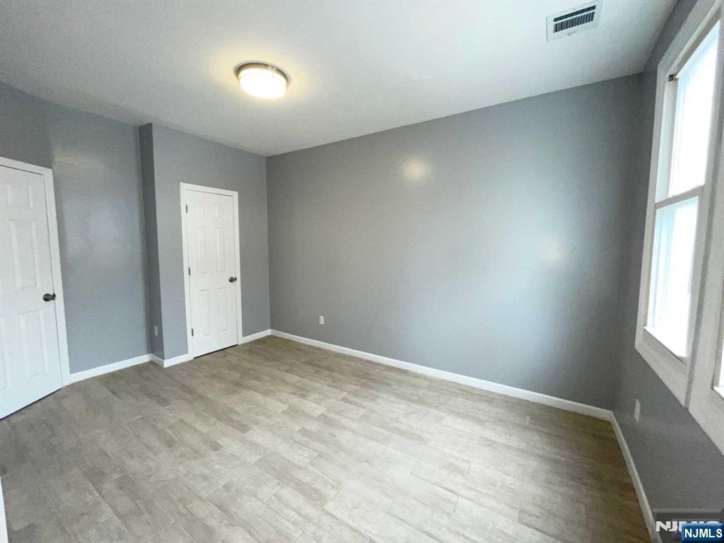 25 Kipp Street Newark, NJ 07108 - Photo 7 of 19 a view of an empty room and window