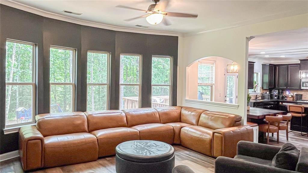 3281 Alhambra Circle Hampton, GA 30228 - Photo 20 of 88 a living room with furniture and a large window