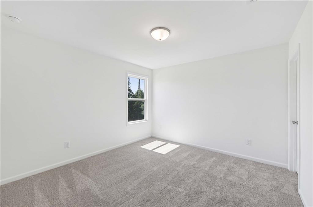 64 Silverleaf Trail Bethlehem, GA 30620 - Photo 26 of 44 a view of an empty room with a window