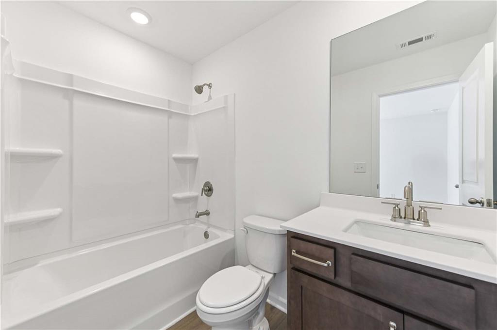 64 Silverleaf Trail Bethlehem, GA 30620 - Photo 28 of 44 a bathroom with a sink a toilet and a bathtub