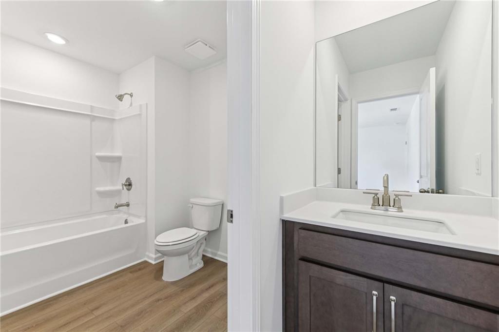 64 Silverleaf Trail Bethlehem, GA 30620 - Photo 32 of 44 a bathroom with a sink toilet a mirror and shower
