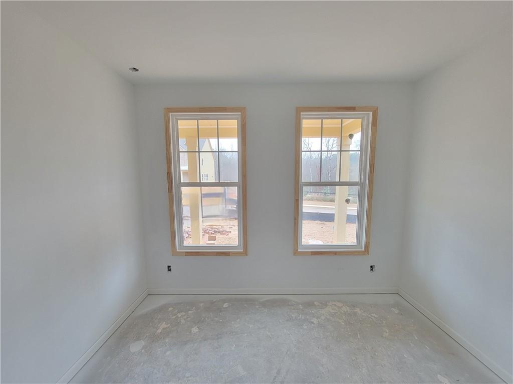 64 Silverleaf Trail Bethlehem, GA 30620 - Photo 4 of 25 an empty room with windows