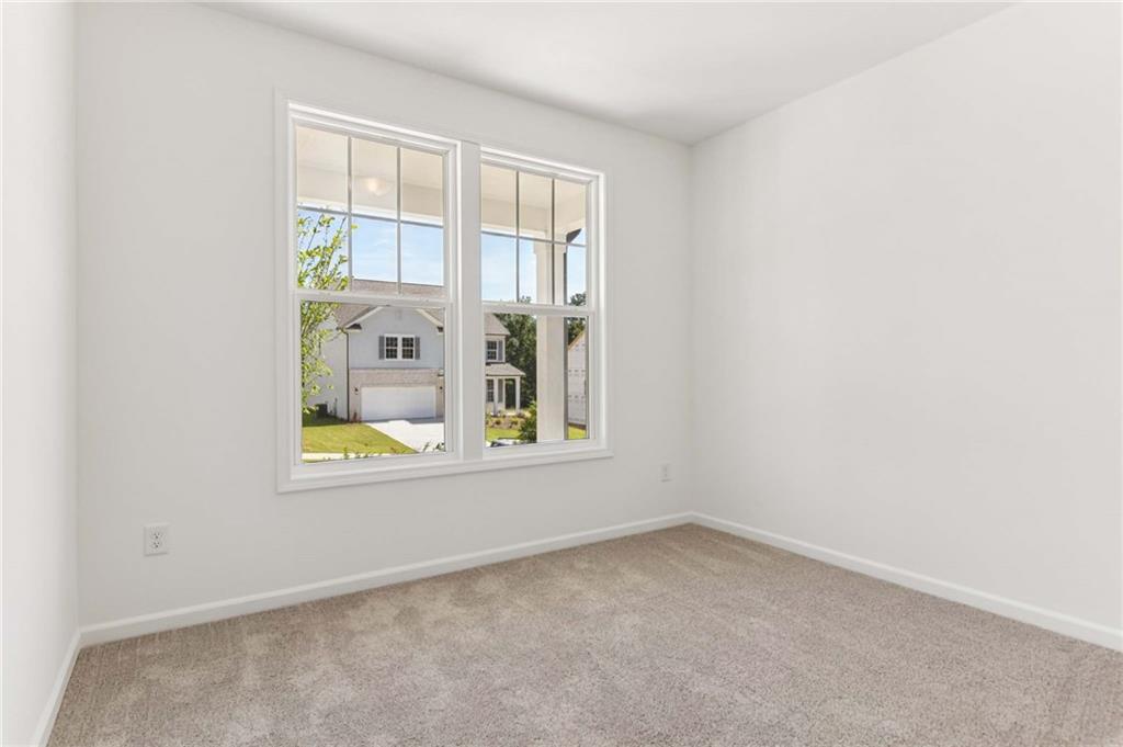 64 Silverleaf Trail Bethlehem, GA 30620 - Photo 4 of 44 an empty room with a window