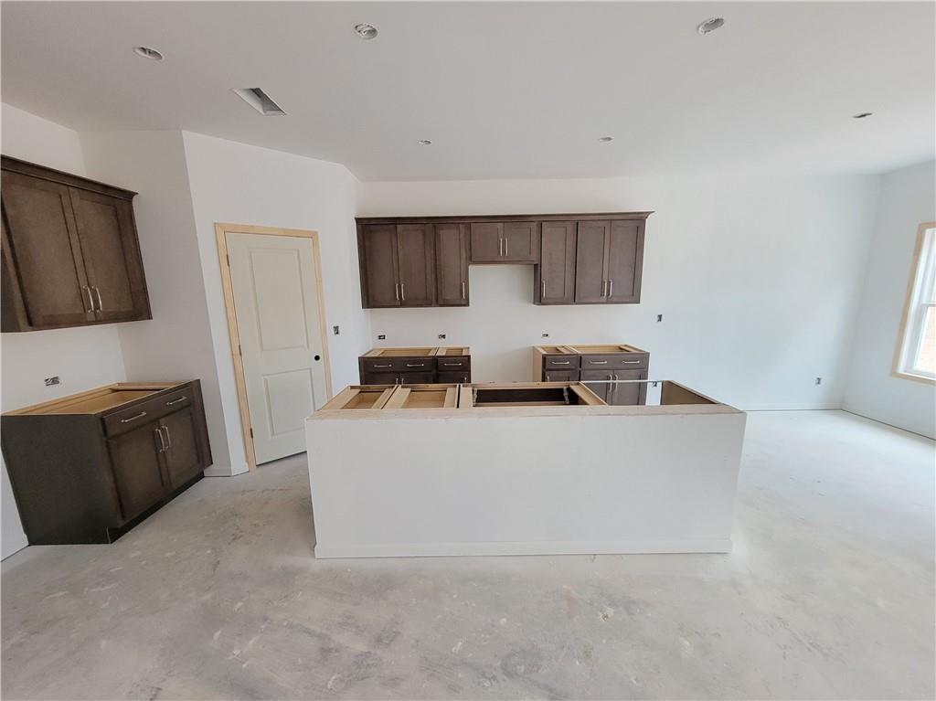 64 Silverleaf Trail Bethlehem, GA 30620 - Photo 7 of 25 a living room with stainless steel appliances kitchen island granite countertop a refrigerator a stove top oven a sink and dishwasher