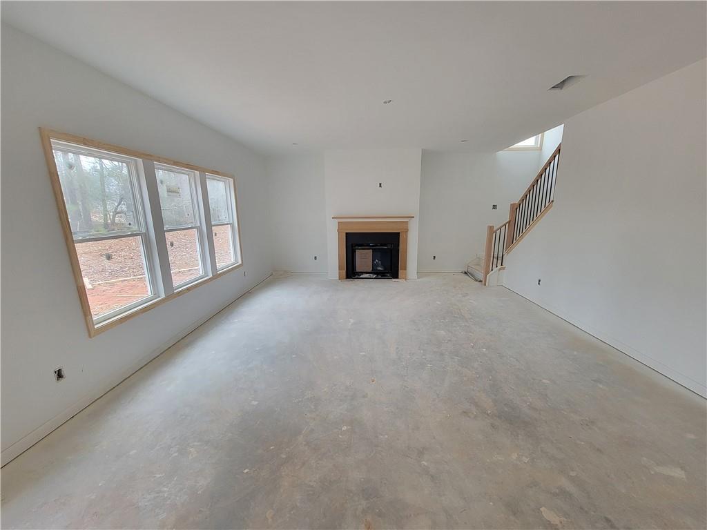 64 Silverleaf Trail Bethlehem, GA 30620 - Photo 9 of 25 a view of empty room with a fireplace