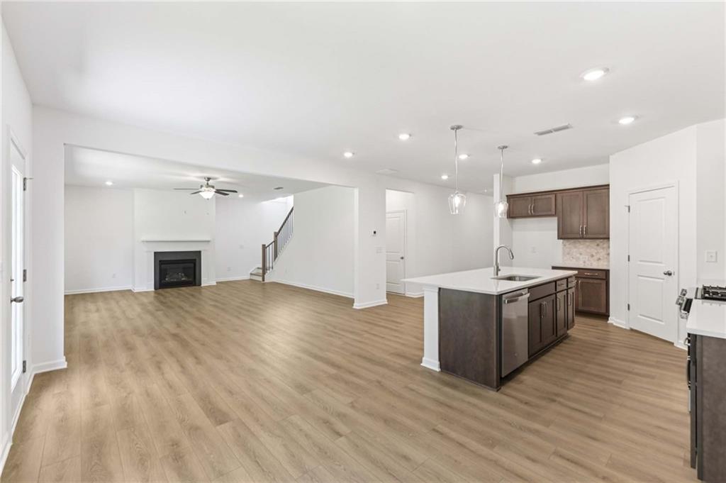 64 Silverleaf Trail Bethlehem, GA 30620 - Photo 10 of 44 a large kitchen with a sink and a refrigerator
