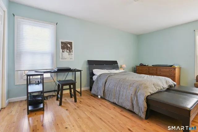 a bedroom with a bed and a table