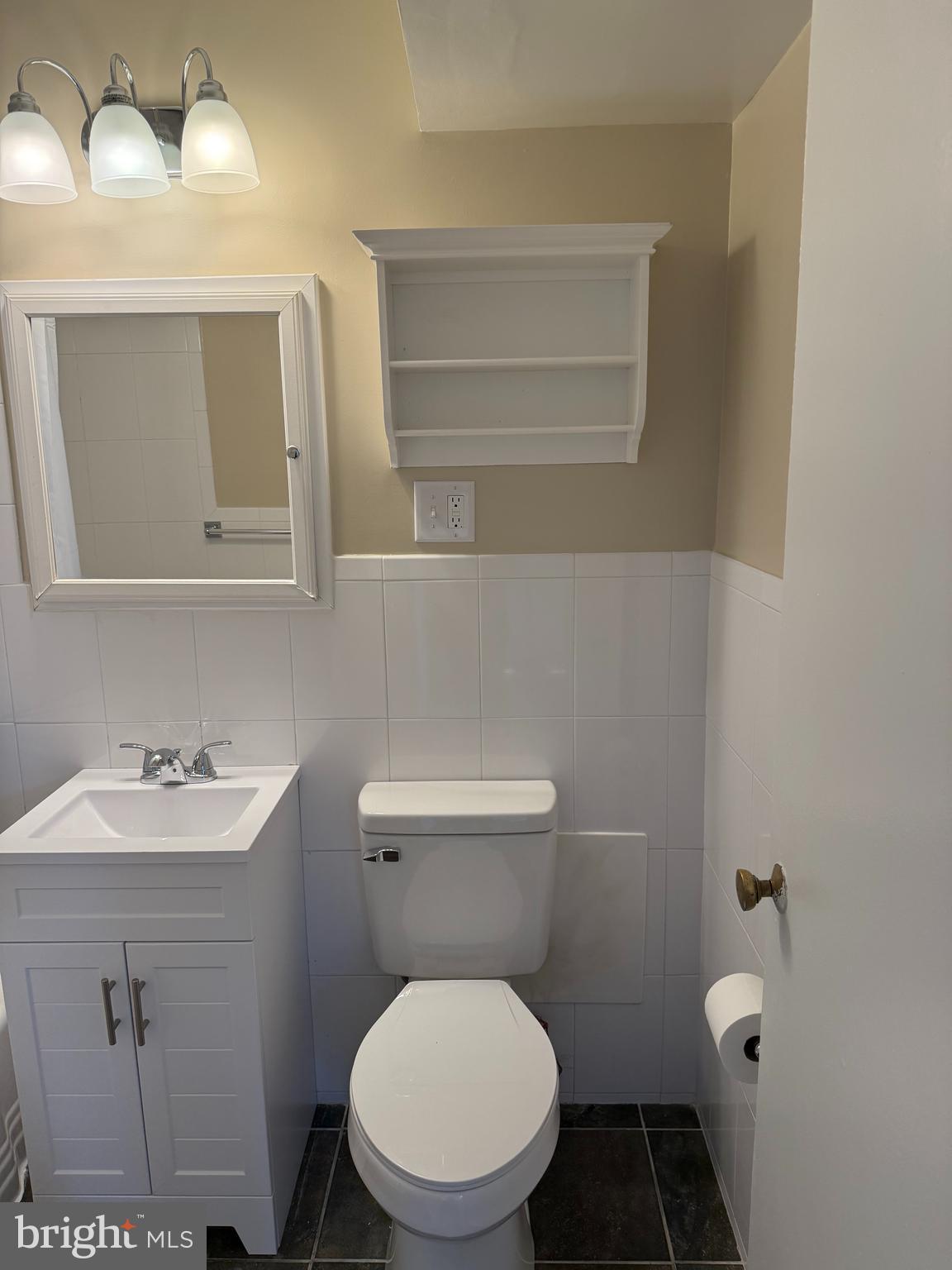 4840 MacArthur Boulevard Northwest, Unit 504 Washington, DC 20007 - Photo 9 of 10 a bathroom with a toilet sink and mirror