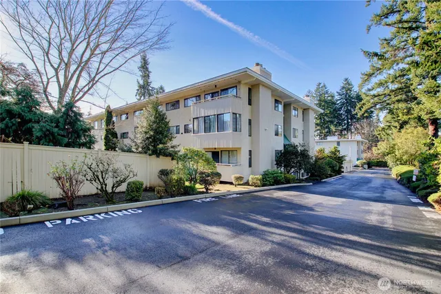 a front view of a house with a yard and a garage