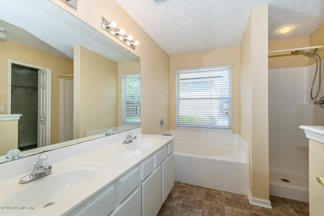 6833 Ridgeview Avenue Jacksonville, FL 32244 - Photo 23 of 31 Main Bathroom with dual vanity sinks