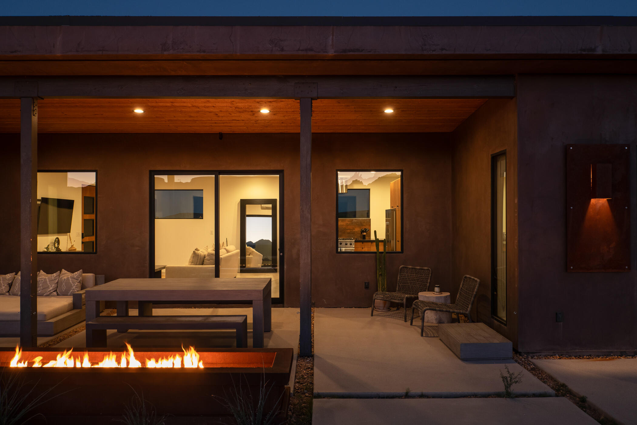 5494 Bronco Road Pioneertown, CA 92268 - Photo 15 of 38 a living room with furniture and a large window