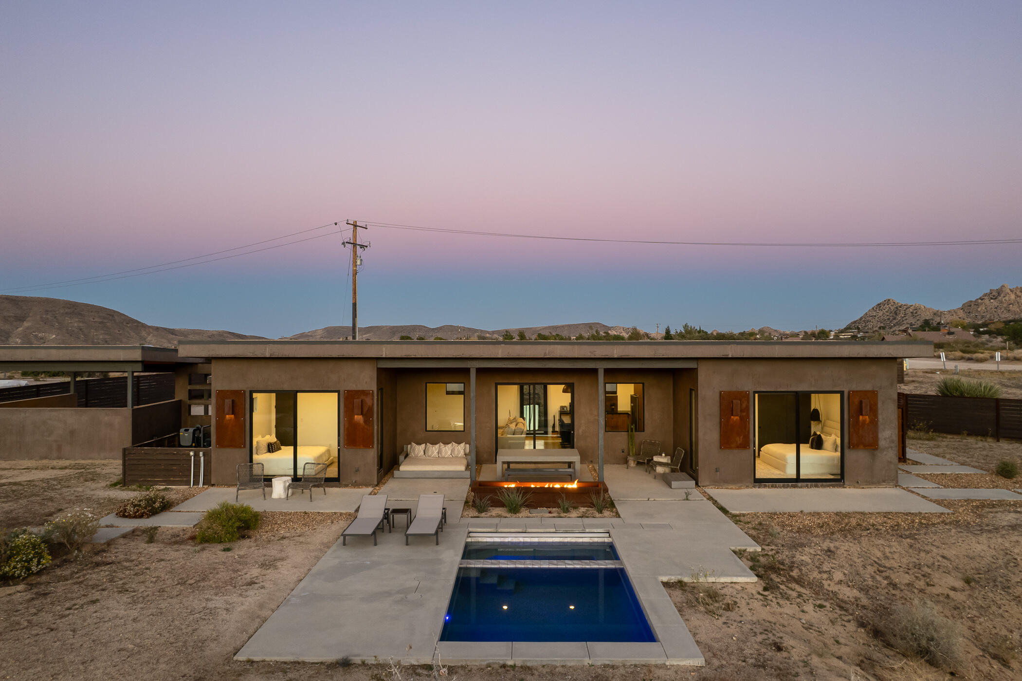 5494 Bronco Road Pioneertown, CA 92268 - Photo 30 of 38 a view of a dinning table and chairs in patio