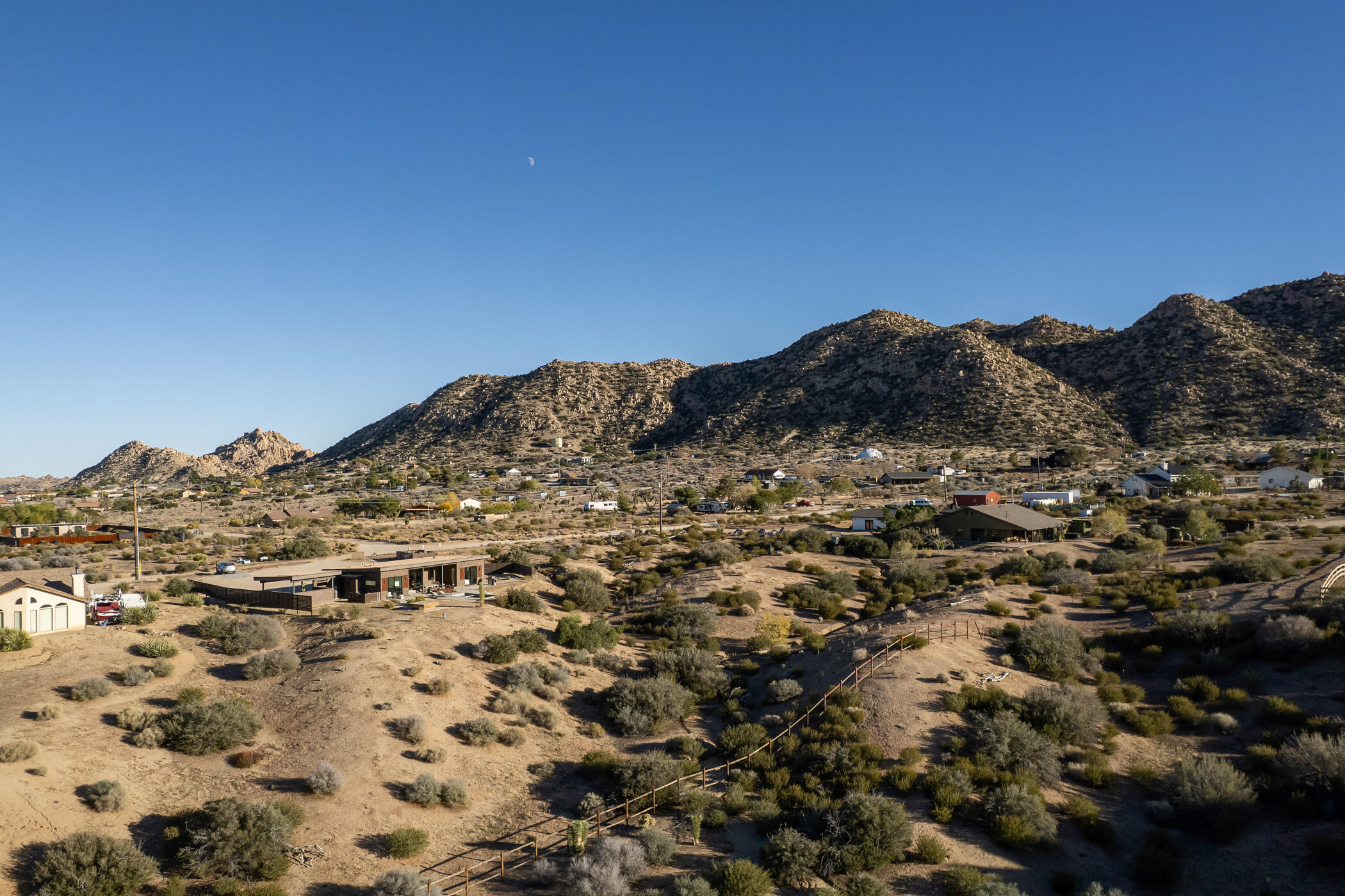5494 Bronco Road Pioneertown, CA 92268 - Photo 6 of 38 a view of a large building with a mountain in the background
