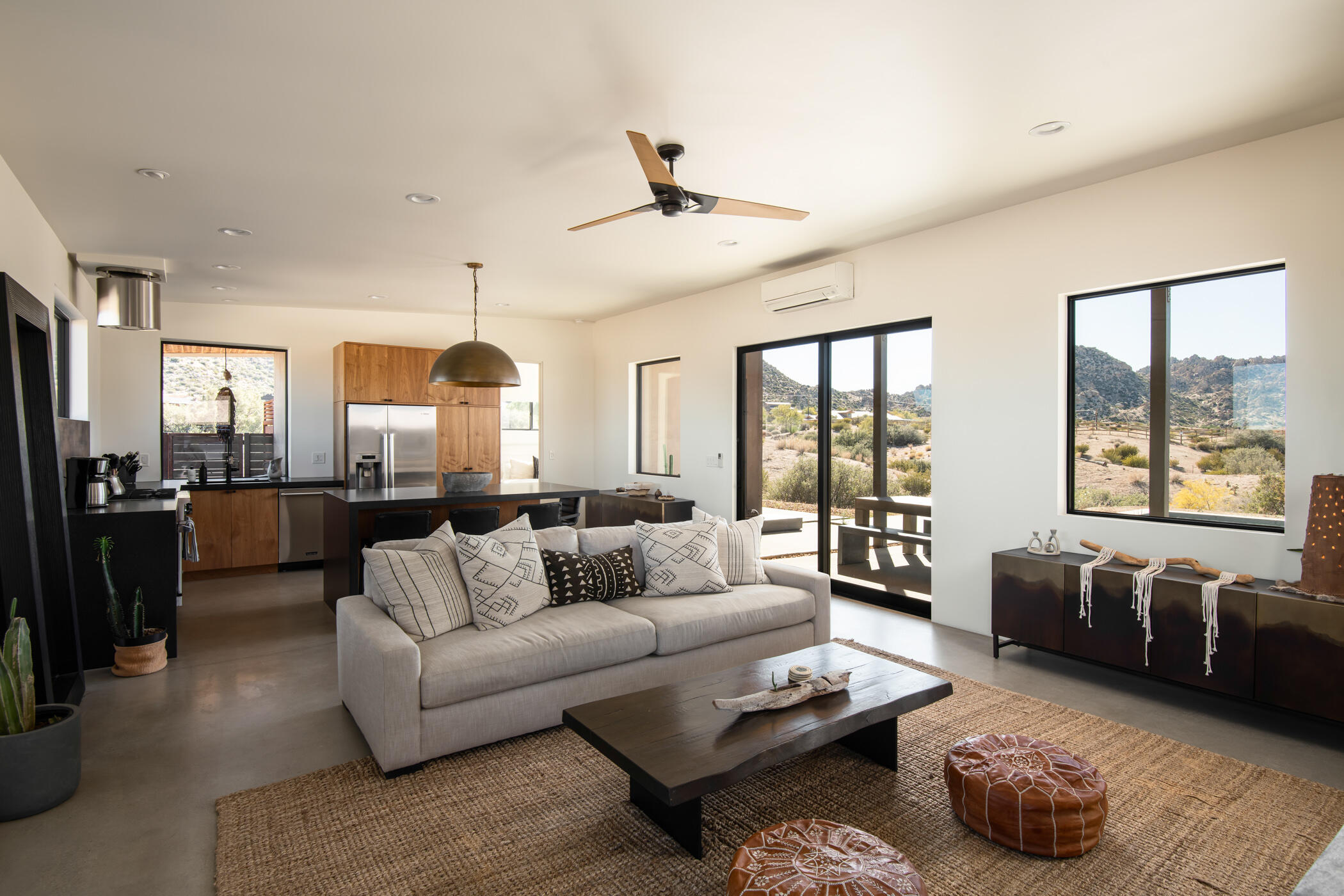 5494 Bronco Road Pioneertown, CA 92268 - Photo 9 of 38 a living room with furniture and a large window