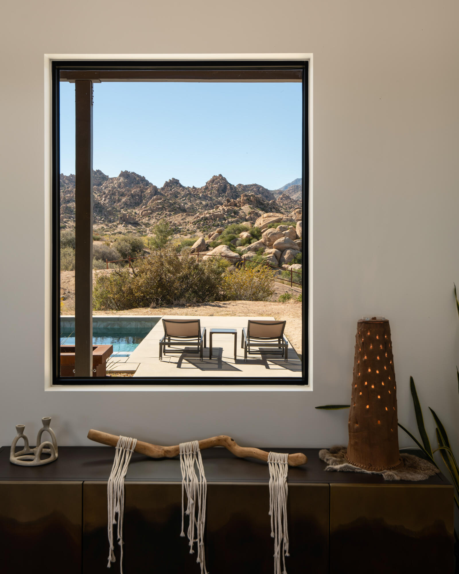 5494 Bronco Road Pioneertown, CA 92268 - Photo 10 of 38 a living room with a table and a window