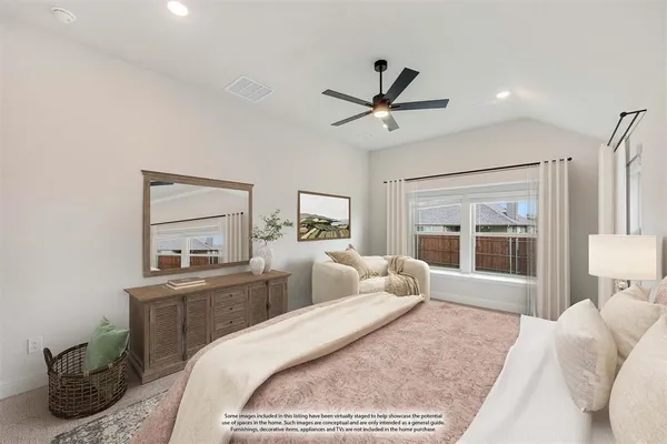 a bedroom with a large bed and a window