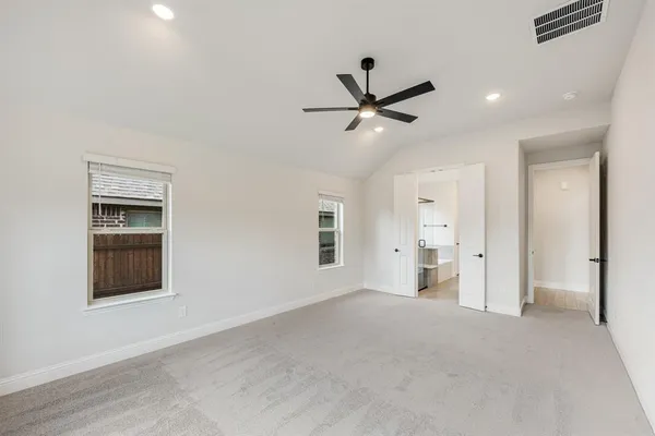 a view of a livingroom with a ceiling fan and window