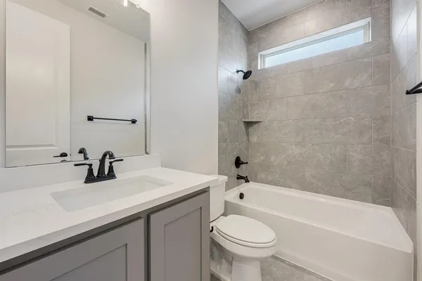 a bathroom with a sink a toilet and a bathtub