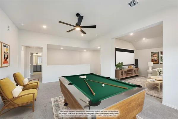 a living room with furniture and a kitchen