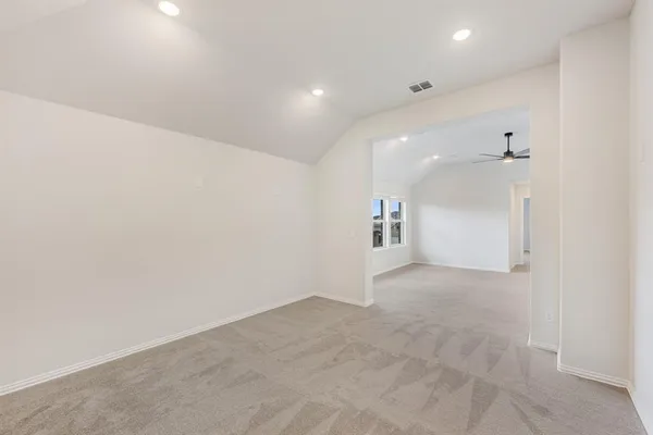 a view of a hallway with a kitchen
