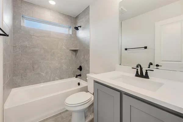 a bathroom with a sink a toilet and a bathtub