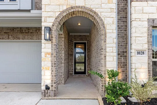 a front view of a house with large windows