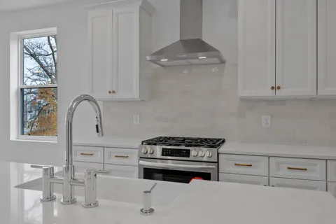 a bathroom with a sink and mirror