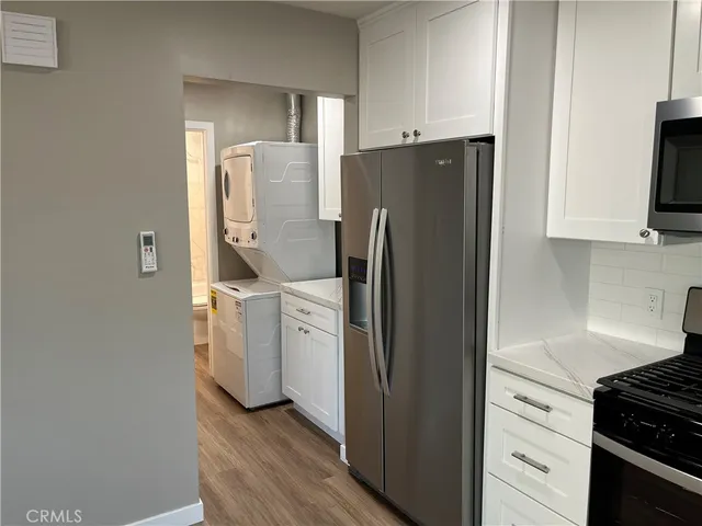 a kitchen with a refrigerator sink and stove