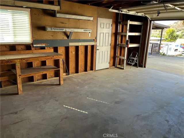 a front view of a house with a garden and yard