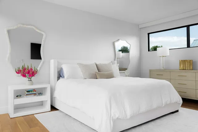 a bedroom with a bed and a couch