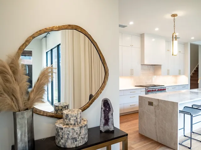 a kitchen with stove and cabinets