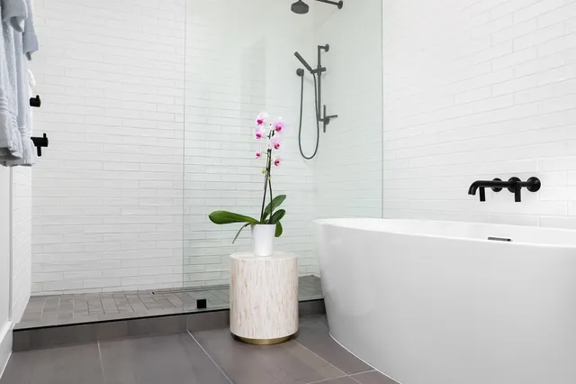 a white bath tub sitting in a bathroom
