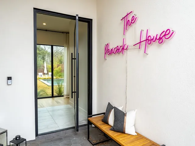a view of an house with swimming pool and porch
