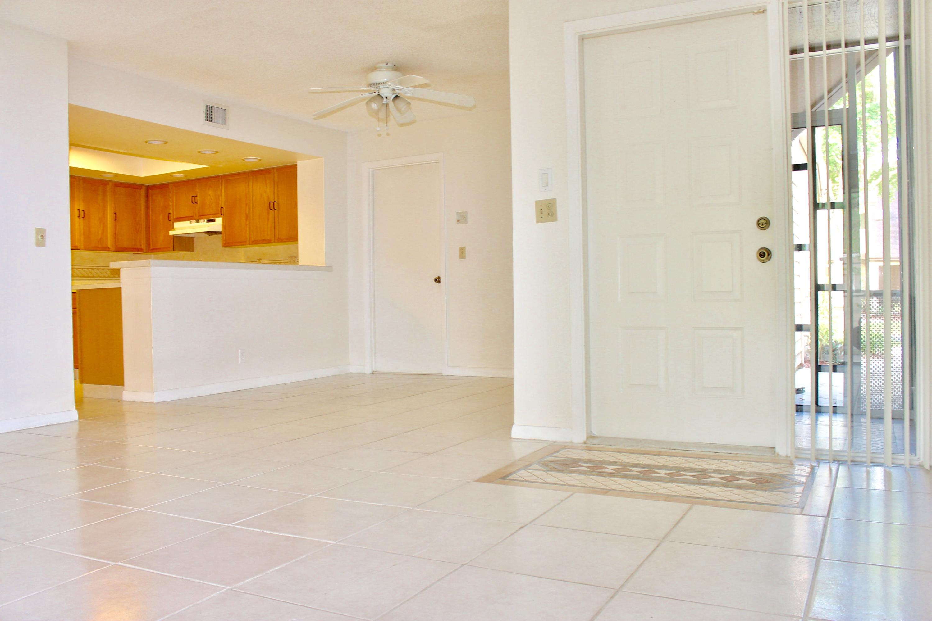 5325 Buckhead Circle, Unit 1020 Boca Raton, FL 33431 - Photo 5 of 19 Front Door and Kitchen