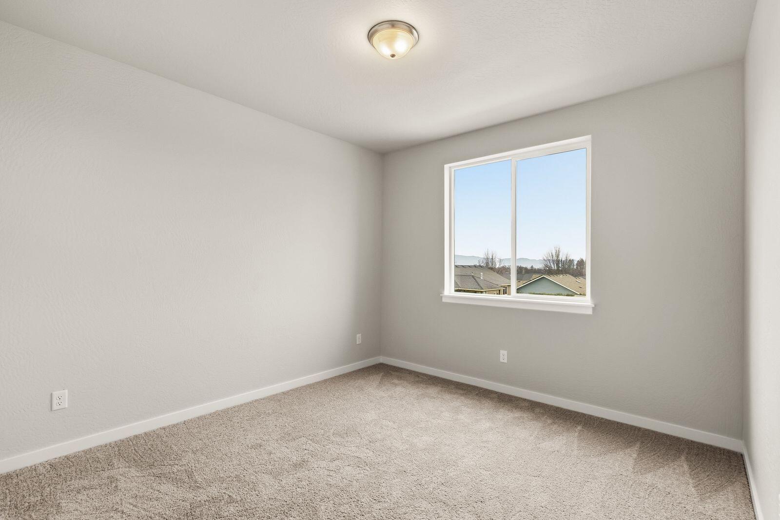 669 Old Waverly Way, Unit 20 Eagle Point, OR 97524 - Photo 17 of 32 an empty room with a window