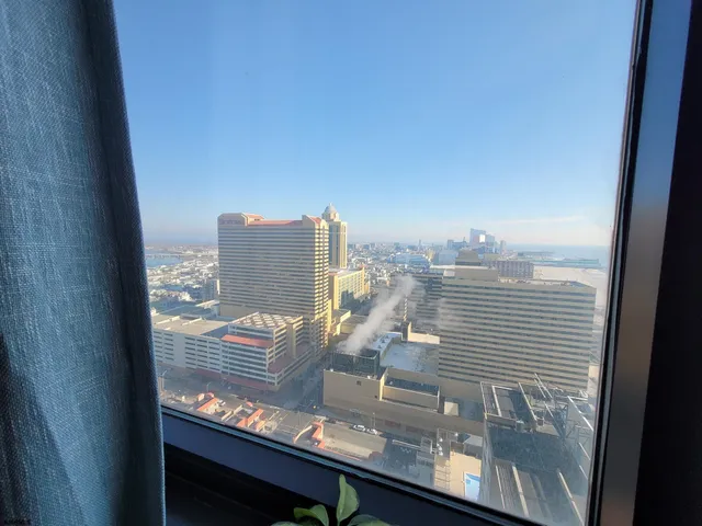 a view of a balcony with seating area
