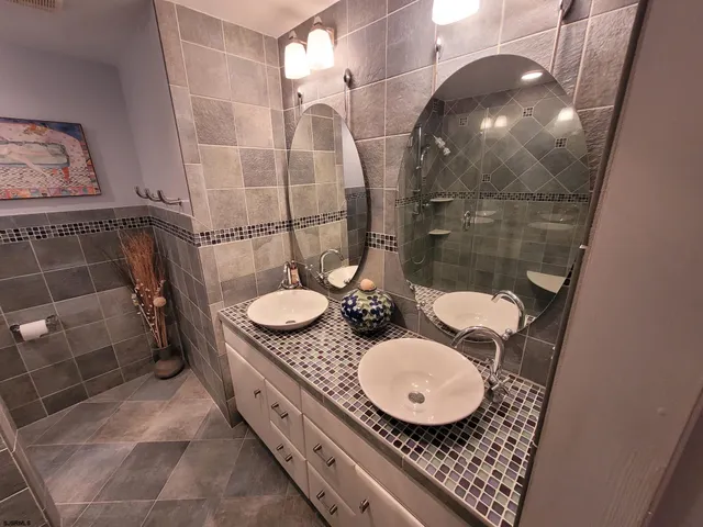 a view of a chairs and table in the balcony