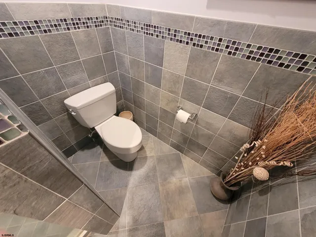 a view of a swimming pool with sitting area