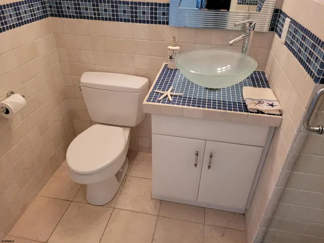 a view of a patio with table and chairs