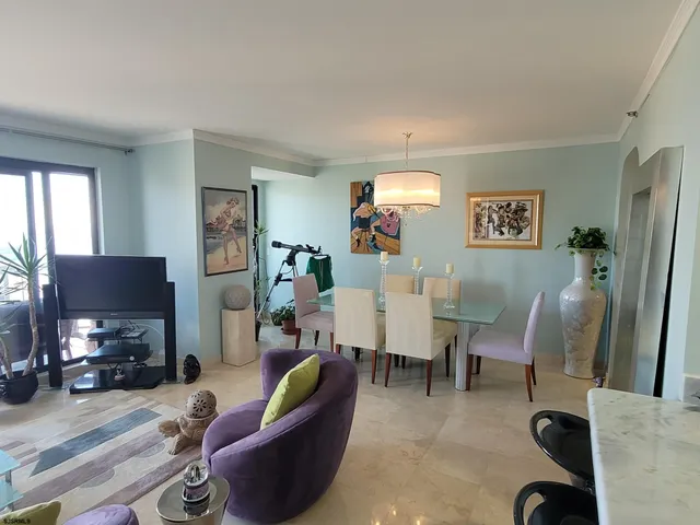 a kitchen with stainless steel appliances granite countertop a sink cabinets and wooden floor